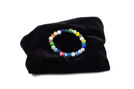 natural cat's eye bracelet on black velvet. On a white background isolateの写真素材