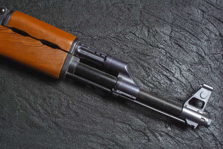 the gun on black concrete