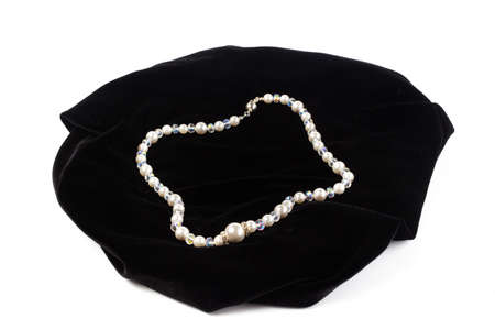 beads from natural Mallorca on black velvet. On a white background isolateの写真素材