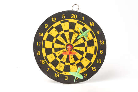 darts target darts all in holes with two green darts and one red on a white background isolateの写真素材