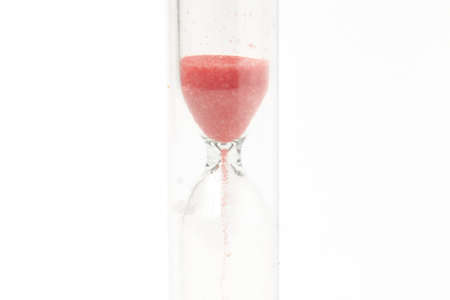 red hourglass on a white background isolate