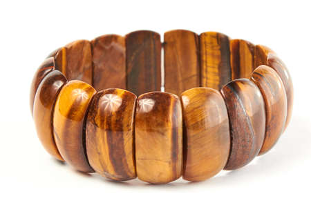 bracelet made of tiger eye gem on a white background. close upの写真素材