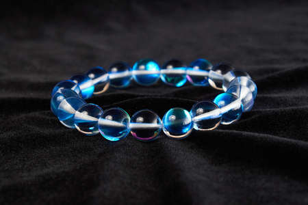 opal glass bracelet semi-precious stone on black velor. close upの写真素材