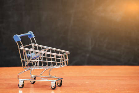 back to school concept, shopping cart on school board background, universityの写真素材