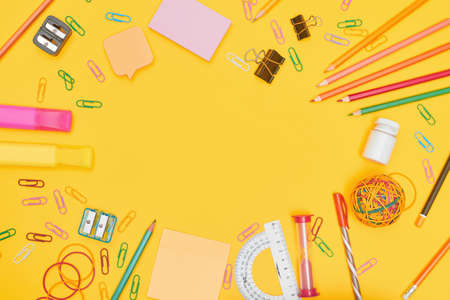 Back to school concept, school supplies on yellow background,flat lay with copy spaceの写真素材