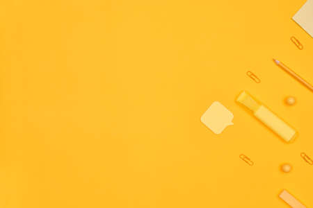 minimalism yellow stationery on a yellow background school, university, flat layer, copy space oneの写真素材