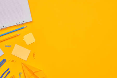 minimalism yellow-blue stationery on yellow background school, university, flat layer, copy space...