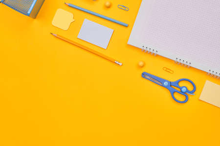 minimalism yellow-blue stationery on yellow background school, university, flat layer, copy space...