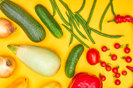 vegetables on yellow background, flatlay oneの写真素材