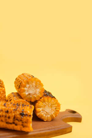 grilled corn on a yellow background, copy spaceの写真素材