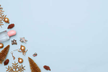 christmas concept, new year, manicure with nail polish, pedicure on blue background, copy space,...