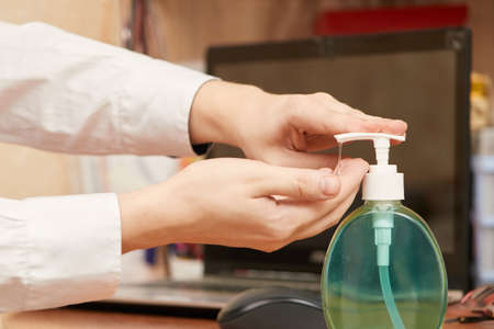 concept, sanitizer sterilize hands near workplace at homeの写真素材