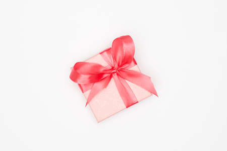 Pink christmas gift on white background isolate, flatley, copy spaceの写真素材