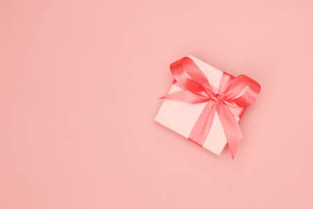 Pink christmas gift on pink background isolate, flatley, copy spaceの写真素材