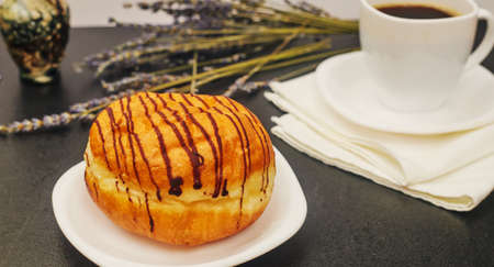 donut on the table and a cup of coffeeの写真素材
