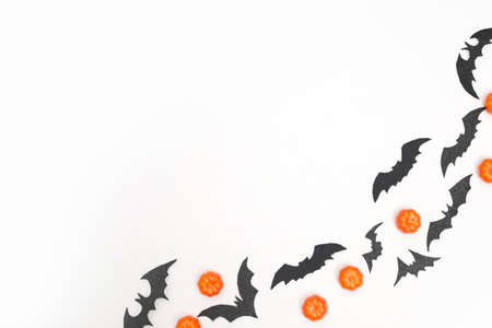 halloween layout with pumpkins and bats on white background copy spaceの写真素材