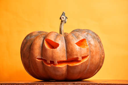 halloween pumpkins on orange background copy spaceの写真素材