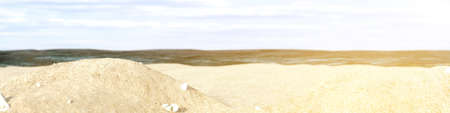 Banner of beach sand with rocks and bokehの写真素材