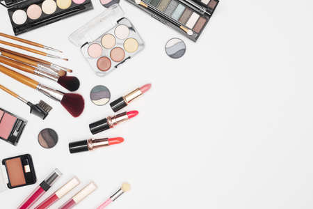 set of professional cosmetics, makeup tools and accessories on white background, beauty, fashion, shopping concept, flat layの写真素材