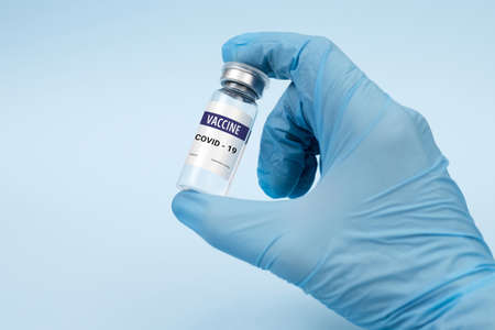 Vaccine against coronavirus, covid-19 concept. on a blue background. copy space, bannerの写真素材