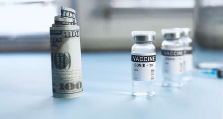 a jar of coronavirus vaccine and a hundred dollar bill. copy space, banner