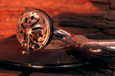 gramophone turntable vinyl records, retro in dust on the background of a stone wall, close-up