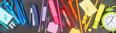 banner back to school, multicolored school supplies, rainbow on school board, flatlay, copyspaceの写真素材