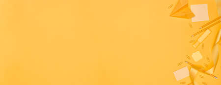 Banner ,Minimalism, Back to school concept Yellow school supplies on yellow background, flat lay copy spaceの写真素材