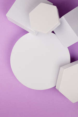 white platform with geometric shapes on a purple backgroundの写真素材