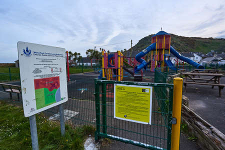 WATERFORD - IRELAND - APRIL 17-2021 COVID 19 poster in a child park. lockdown virus. no peopleのeditorial素材