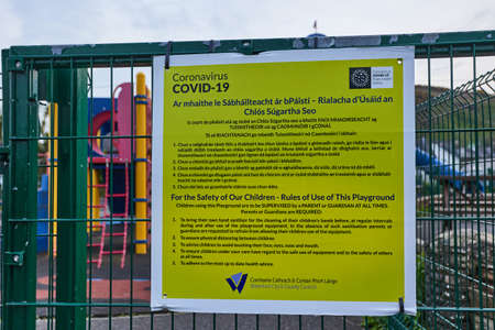 WATERFORD - IRELAND - APRIL 17-2021 COVID 19 poster in a child park. lockdown virus. no peopleのeditorial素材