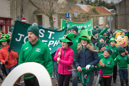 NEW ROSS - WEXFORD- IRELAND - MARCH 17-2018 St. Patrick's Parade. people and musicians enjoying the traditional Irish holidayのeditorial素材