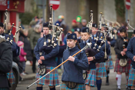 NEW ROSS - WEXFORD- IRELAND - MARCH 17-2018 St. Patrick's Parade. people and musicians enjoying the...