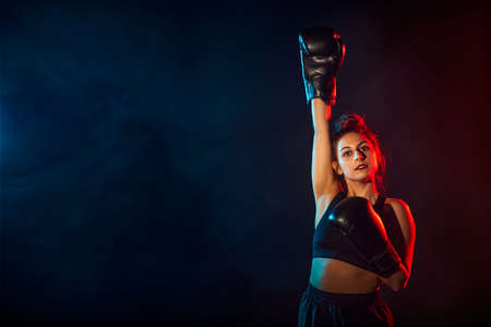 Attractive fighter girl, studio shot. sports victory concept.の写真素材