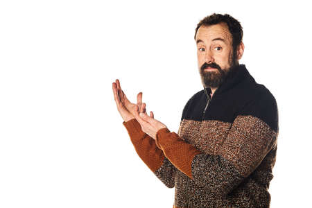 happy Caucasian bearded man in the 40s teaching with his hands something, on an isolated white...