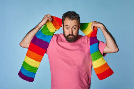 portrait gay man with rainbow colored scarf. gay pride day lgbq community.の写真素材