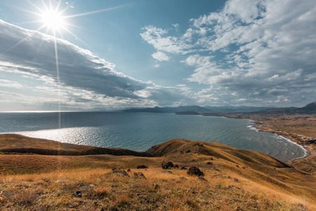 Summer landscape with a rocky coast by the sea. Black Sea, southern coast of Crimea, Europe