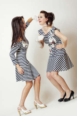 two fashion emotion girl in strip clothesの写真素材