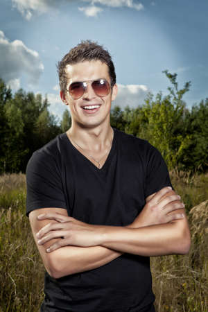 smile young man, summer outdoorの写真素材