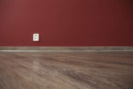 red interior wall and wood floorの写真素材