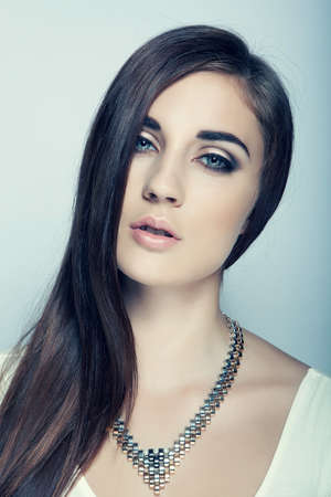 beautiful high key girl with long hair, blue eyesの写真素材