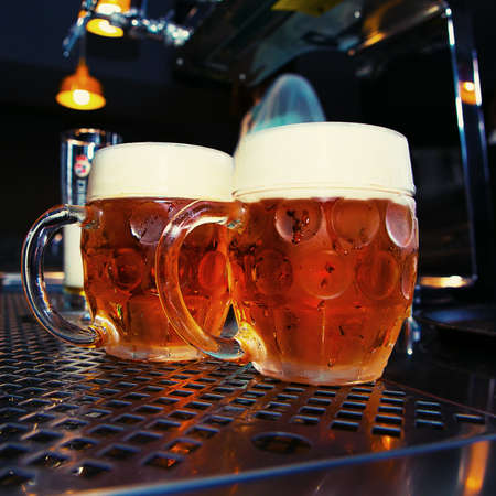 big Beer glass on a bar table. Closeup