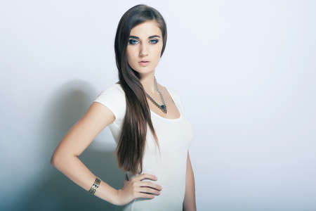 portrait beautiful high key cute girl with long hair, blue eyesの写真素材