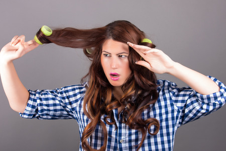 portrait of beautiful young woman with long curly hairの写真素材