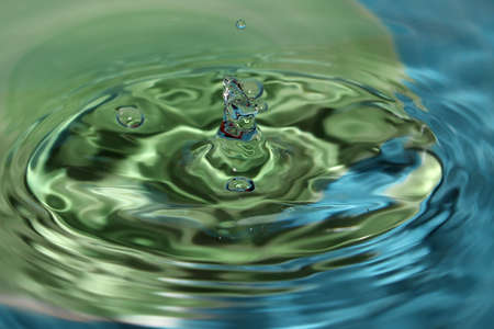 Water drop splashes in the waterの写真素材