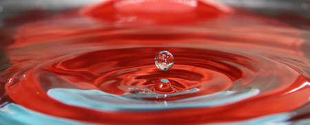 Water drop splashes in the waterの写真素材