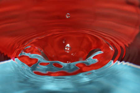Water drop splashes in the waterの写真素材