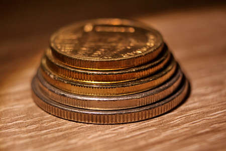 Coins on the table, few coins of different sizes together