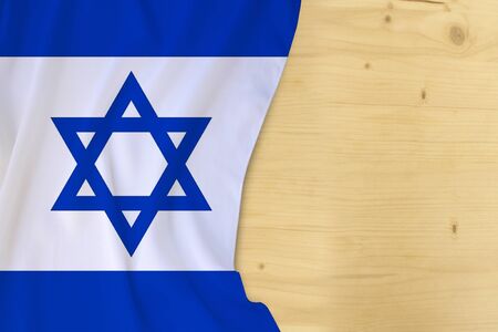 silk colored national flag of the country of Israel, empty wooden mocap for text, concept of tourism, travel, emigration, global business, independence dayの写真素材