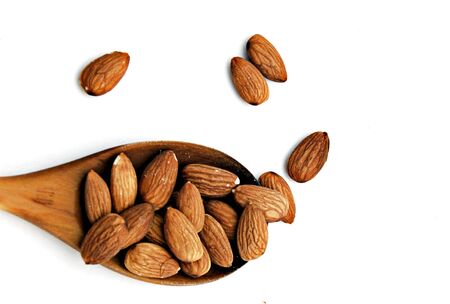tablespoon almonds on white backgroundの写真素材